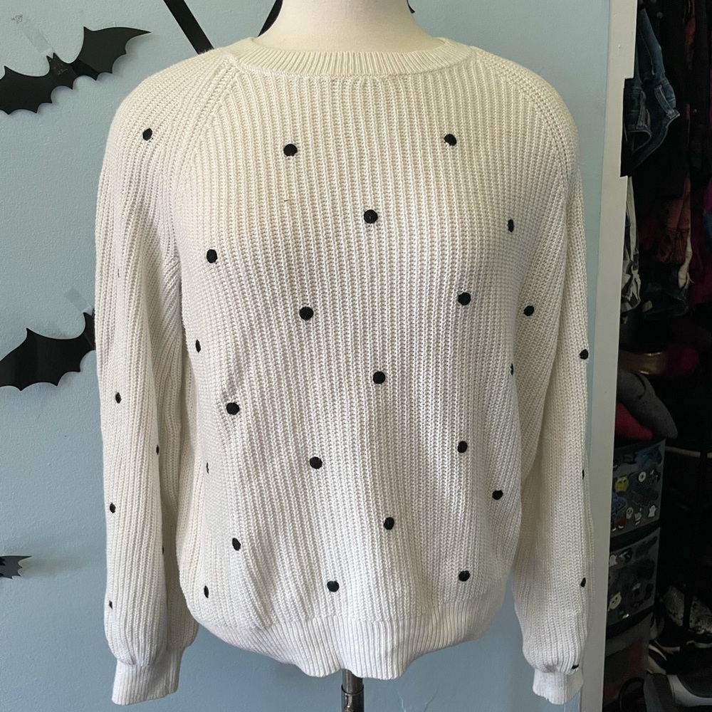 White sweater with black polka dots